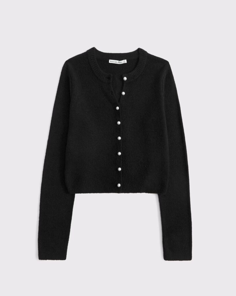 Body-skimming cardigan in our super soft sweater yarn fabric, featuring a crew neckline, button-up front with pearl buttons and rib stitching details along the neckline, cuffs and hem. Pairs perfect with your favorite skirt or pants!